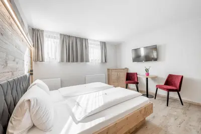 Ein Bett oder Betten in einem Zimmer der Unterkunft Gasthof Schroll