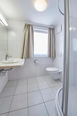 Ein Badezimmer in der Unterkunft TownHouse Appartements