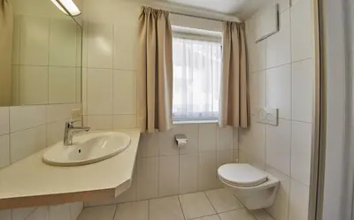Ein Badezimmer in der Unterkunft TownHouse Appartements