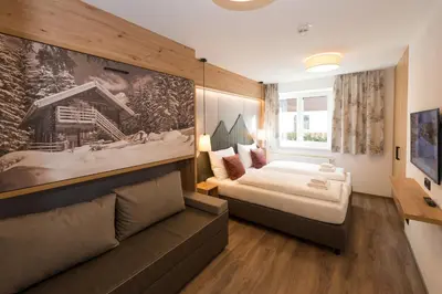 Ein Bett oder Betten in einem Zimmer der Unterkunft Der Zirmhof in Saalbach - Joker Card included in summer