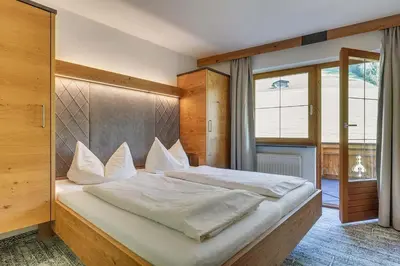 Ein Bett oder Betten in einem Zimmer der Unterkunft Apparthotel Talhof, Restaurant, Pool und Spa