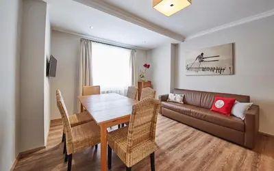Ein Sitzbereich in der Unterkunft Hüttl Relax Appartements