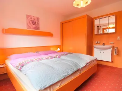 Ein Bett oder Betten in einem Zimmer der Unterkunft Ferienwohnung Saalbach Fieberbrunn