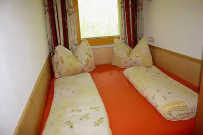 Ein Bett oder Betten in einem Zimmer der Unterkunft Ferienwohnung Saalbach Fieberbrunn