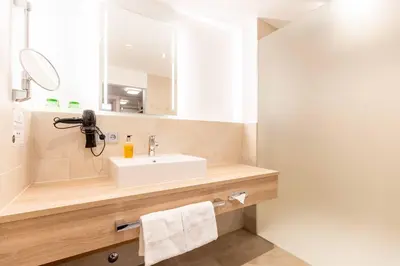 Ein Badezimmer in der Unterkunft Das Walchsee Resort