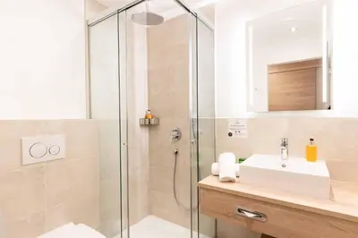 Ein Badezimmer in der Unterkunft Das Walchsee Resort