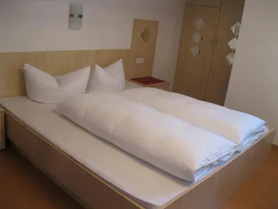 Ein Bett oder Betten in einem Zimmer der Unterkunft Appartement Geisler