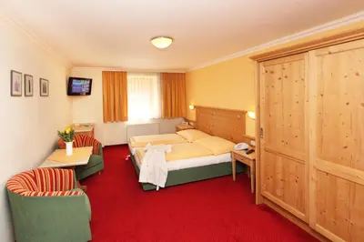 Ein Bett oder Betten in einem Zimmer der Unterkunft Hotel Unterwirt - Jokercard im Sommer inklusive