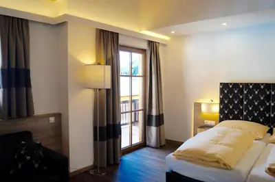 Ein Bett oder Betten in einem Zimmer der Unterkunft Hotel Unterwirt - Jokercard im Sommer inklusive