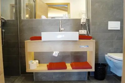 Ein Badezimmer in der Unterkunft Hotel Unterwirt - Jokercard im Sommer inklusive