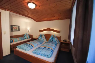 Ein Bett oder Betten in einem Zimmer der Unterkunft Gästehaus Aigner