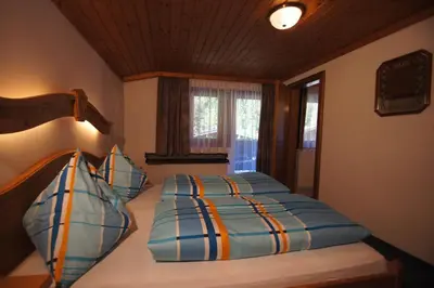 Ein Bett oder Betten in einem Zimmer der Unterkunft Gästehaus Aigner