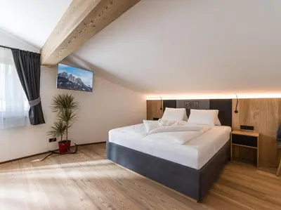 Ein Bett oder Betten in einem Zimmer der Unterkunft Dorfkaiser Appartements