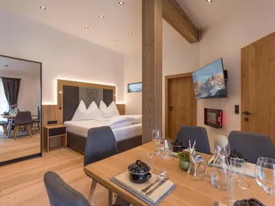 Ein Bett oder Betten in einem Zimmer der Unterkunft Dorfkaiser Appartements