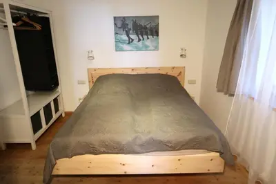 Ein Bett oder Betten in einem Zimmer der Unterkunft Retro Apartment Kitzbühel