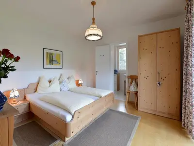 Ein Bett oder Betten in einem Zimmer der Unterkunft Rosenhof am See Ferienwohnungen