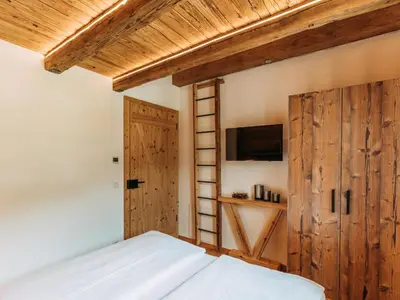 Ein Bett oder Betten in einem Zimmer der Unterkunft Tauernlodge Krimml 1A