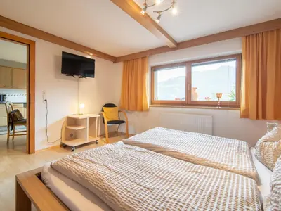 Ein Bett oder Betten in einem Zimmer der Unterkunft Ferienhaus Tenndl II