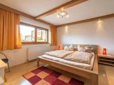 Ein Bett oder Betten in einem Zimmer der Unterkunft Ferienhaus Tenndl II