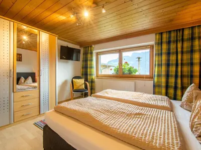 Ein Bett oder Betten in einem Zimmer der Unterkunft Ferienhaus Tenndl II