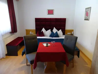 Ein Sitzbereich in der Unterkunft Hotel Restaurant Rosengarten
