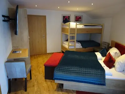 Ein Bett oder Betten in einem Zimmer der Unterkunft Hotel Restaurant Rosengarten