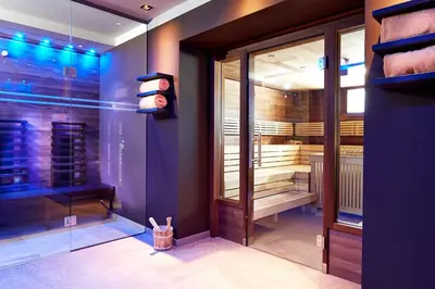 Ein Bett oder Betten in einem Zimmer der Unterkunft Fairhotel Hochfilzen B&B