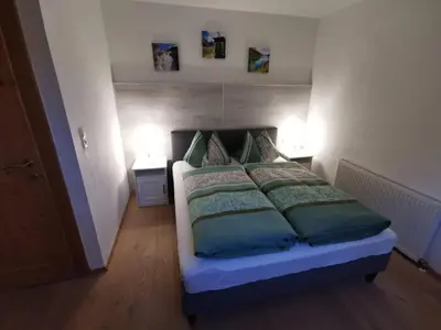 Ein Bett oder Betten in einem Zimmer der Unterkunft Ferienwohnung Magdalena