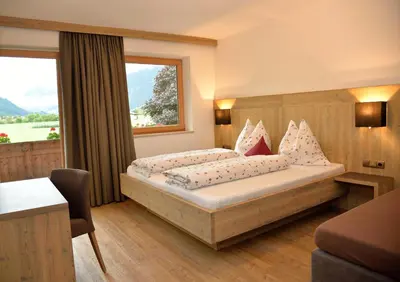 Ein Bett oder Betten in einem Zimmer der Unterkunft Klausnerhof