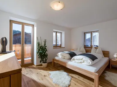 Ein Bett oder Betten in einem Zimmer der Unterkunft Ferienwohnung Döllerer