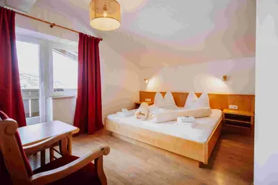 Ein Bett oder Betten in einem Zimmer der Unterkunft Hotel in the HEART of the Alps