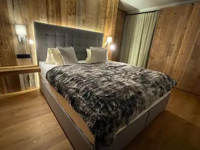 Ein Bett oder Betten in einem Zimmer der Unterkunft Appartements Lorenzoni, Cafe Konditorei Helmut Lorenzoni
