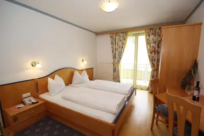 Ein Bett oder Betten in einem Zimmer der Unterkunft Hotel Bärenbachhof - Joker card included in summer