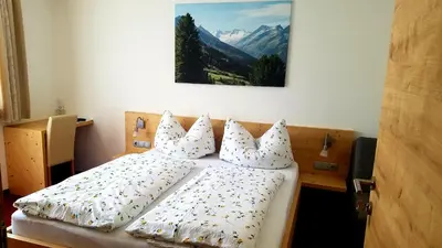 Ein Bett oder Betten in einem Zimmer der Unterkunft Haus Maria
