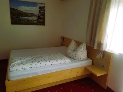 Ein Bett oder Betten in einem Zimmer der Unterkunft Haus Maria
