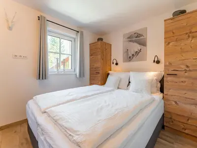 Ein Bett oder Betten in einem Zimmer der Unterkunft Tauernlodge Berglust