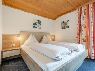 Ein Bett oder Betten in einem Zimmer der Unterkunft Eder II Saalbach