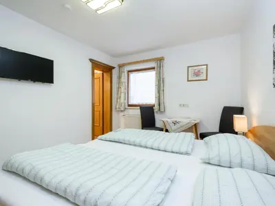 Ein Bett oder Betten in einem Zimmer der Unterkunft Birgit Hinterglemm