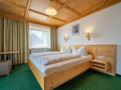 Ein Bett oder Betten in einem Zimmer der Unterkunft Ferienhaus Almhof