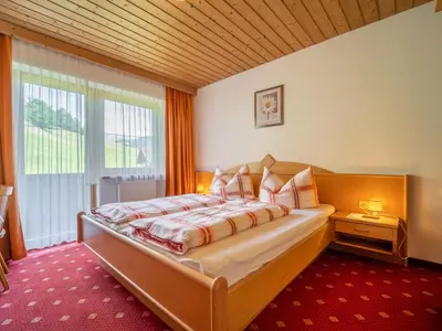Ein Bett oder Betten in einem Zimmer der Unterkunft Ferienhaus Almhof