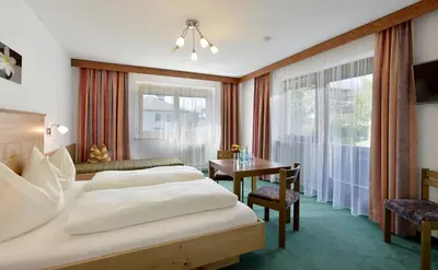 Ein Bett oder Betten in einem Zimmer der Unterkunft Apart Kofler's Panorama-Zillertal