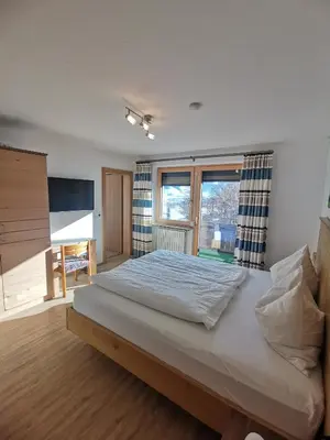 Ein Bett oder Betten in einem Zimmer der Unterkunft Apart Kofler's Panorama-Zillertal