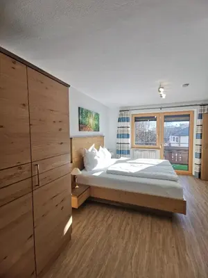 Ein Bett oder Betten in einem Zimmer der Unterkunft Apart Kofler's Panorama-Zillertal