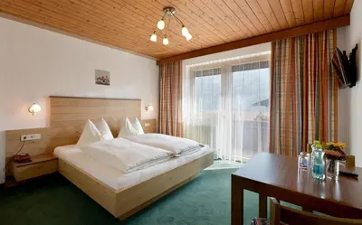 Ein Bett oder Betten in einem Zimmer der Unterkunft Apart Kofler's Panorama-Zillertal