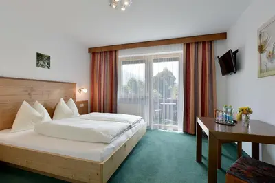 Ein Bett oder Betten in einem Zimmer der Unterkunft Apart Kofler's Panorama-Zillertal