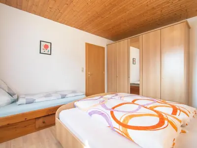 Ein Bett oder Betten in einem Zimmer der Unterkunft Haus Sporer