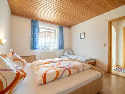 Ein Bett oder Betten in einem Zimmer der Unterkunft Haus Sporer
