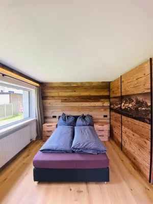 Ein Bett oder Betten in einem Zimmer der Unterkunft Kitz Kaiser Appartement