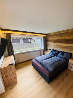 Ein Bett oder Betten in einem Zimmer der Unterkunft Kitz Kaiser Appartement