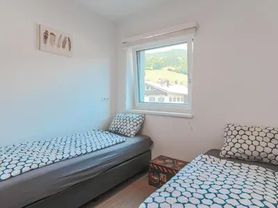 Ein Bett oder Betten in einem Zimmer der Unterkunft Residenz Brixental Top 8